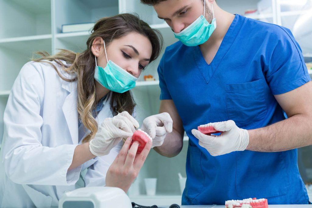 dentists working on Emergency Partial Dentures