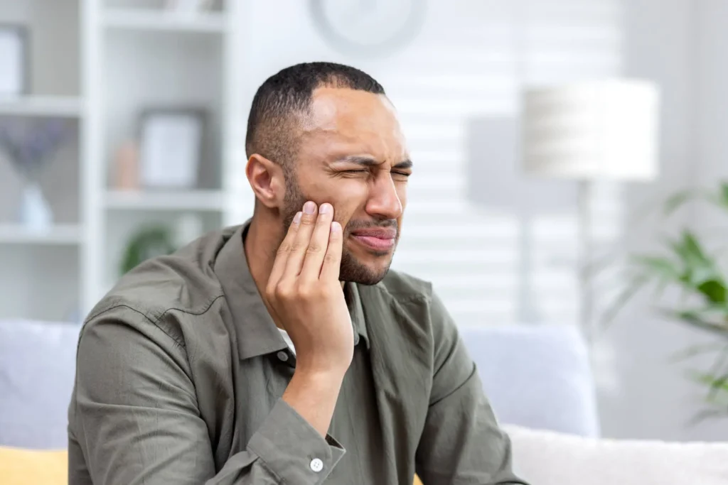 man in pain needs general dentistry naples