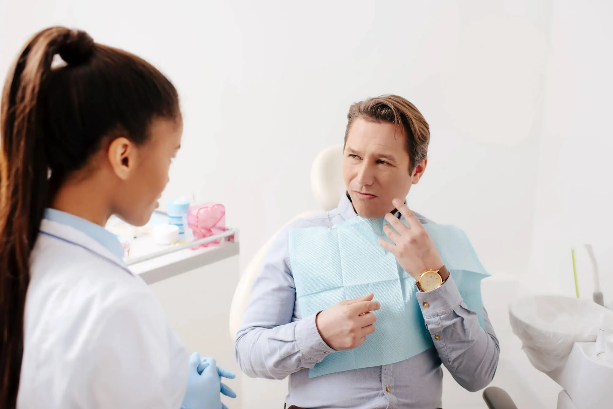 discussing emergency dental care naples