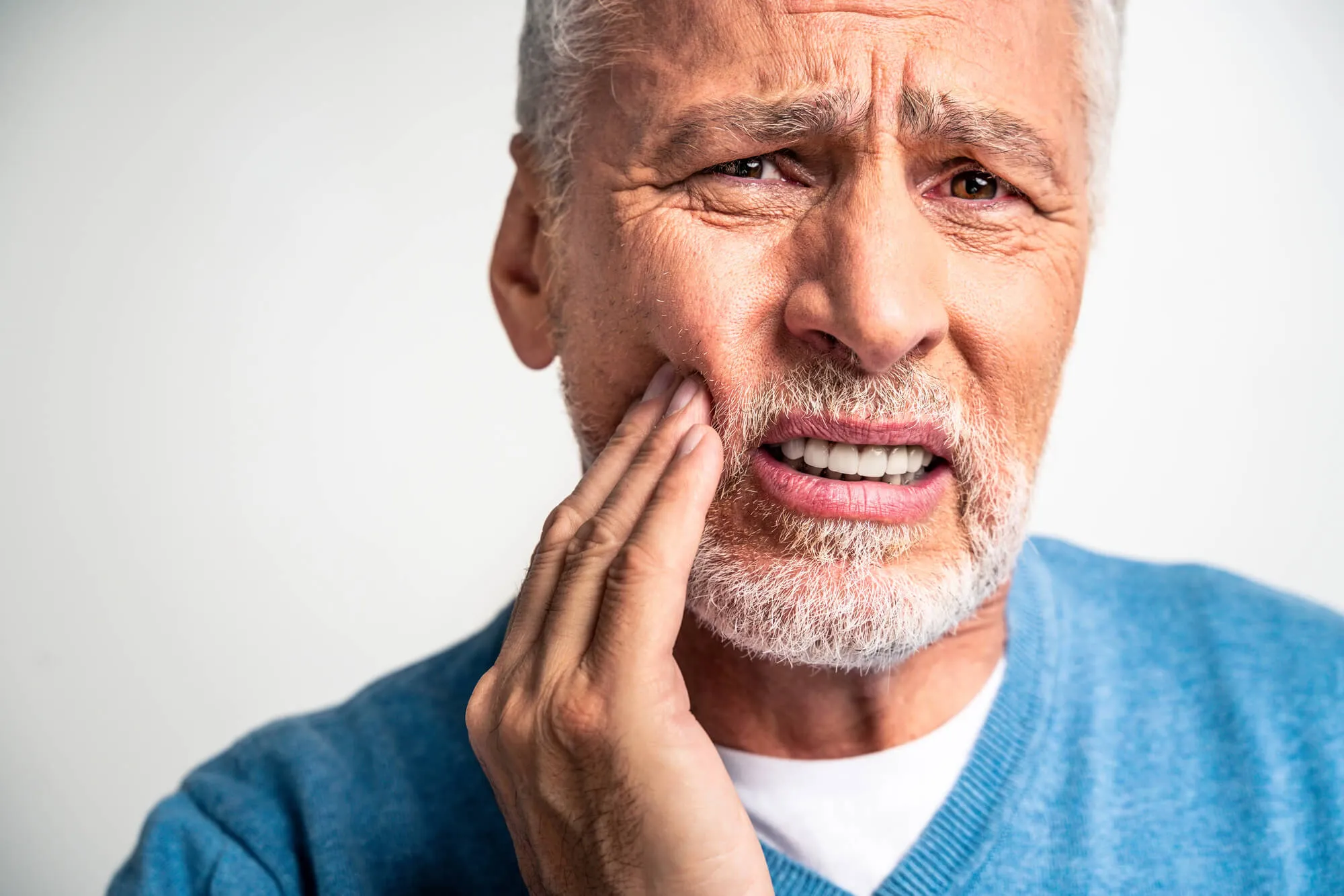 patient with denture pain needs to visit a denture studio naples